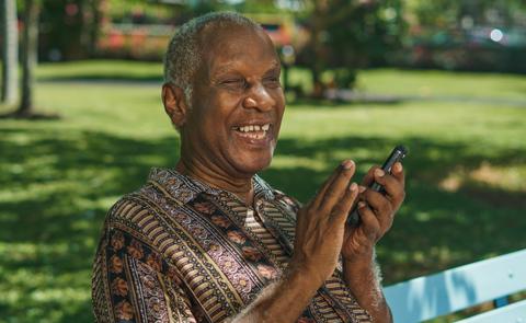 Visually impaired man laughing